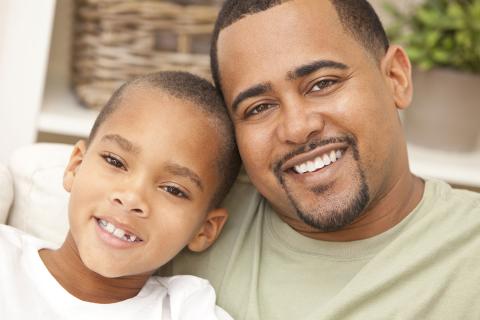 Smiling father and son