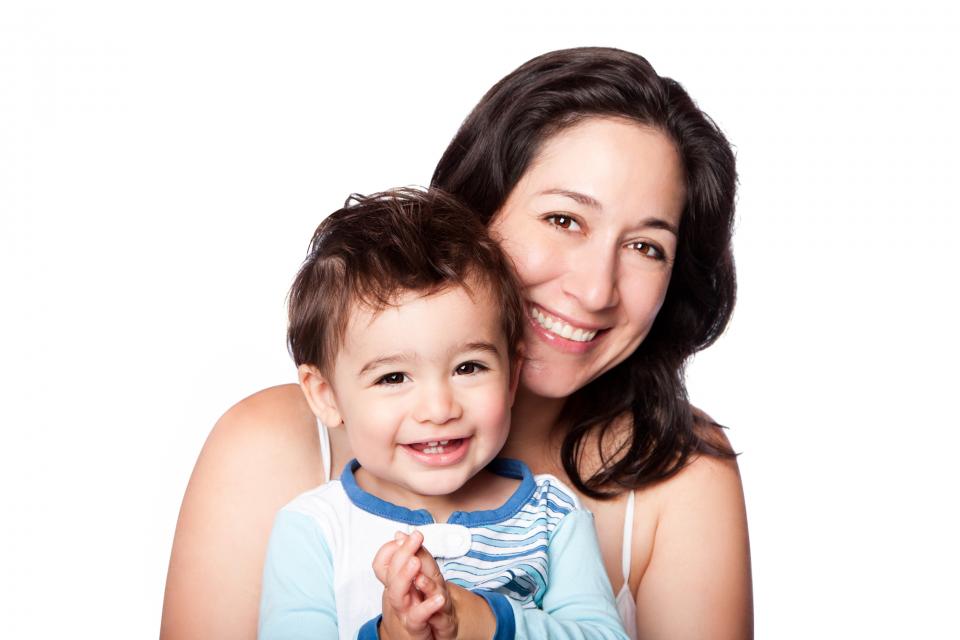 Smiling mom holding baby