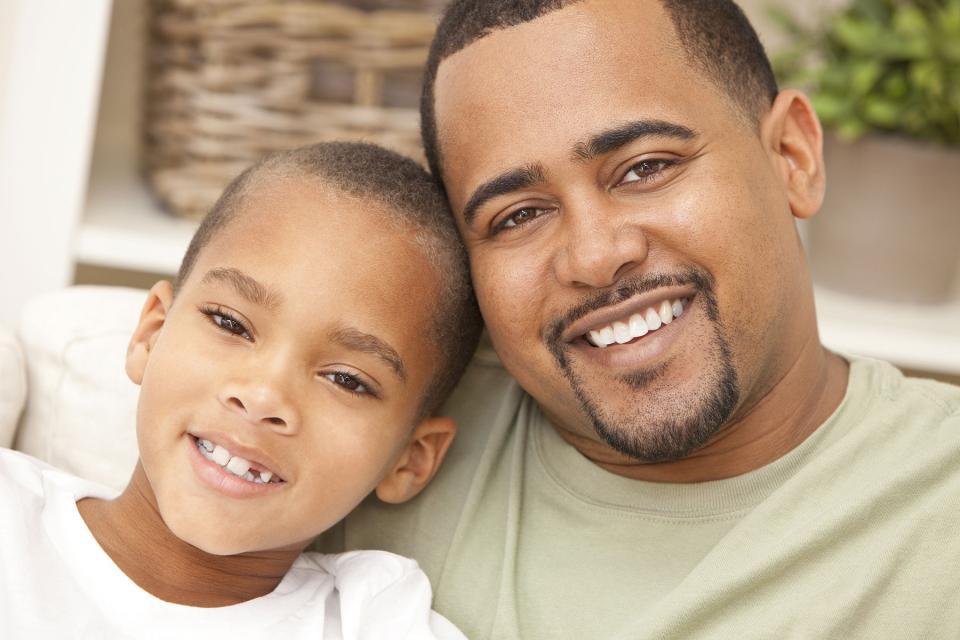 Smiling father and son