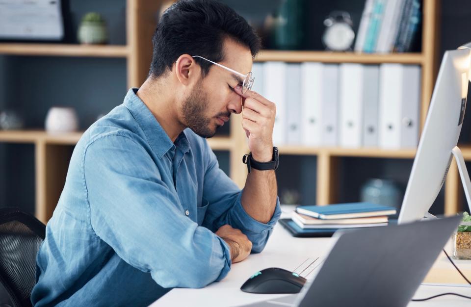 Man frustrated while working.