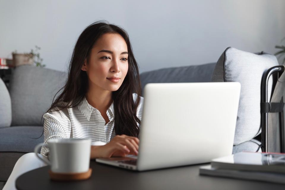 Serious woman on laptop.
