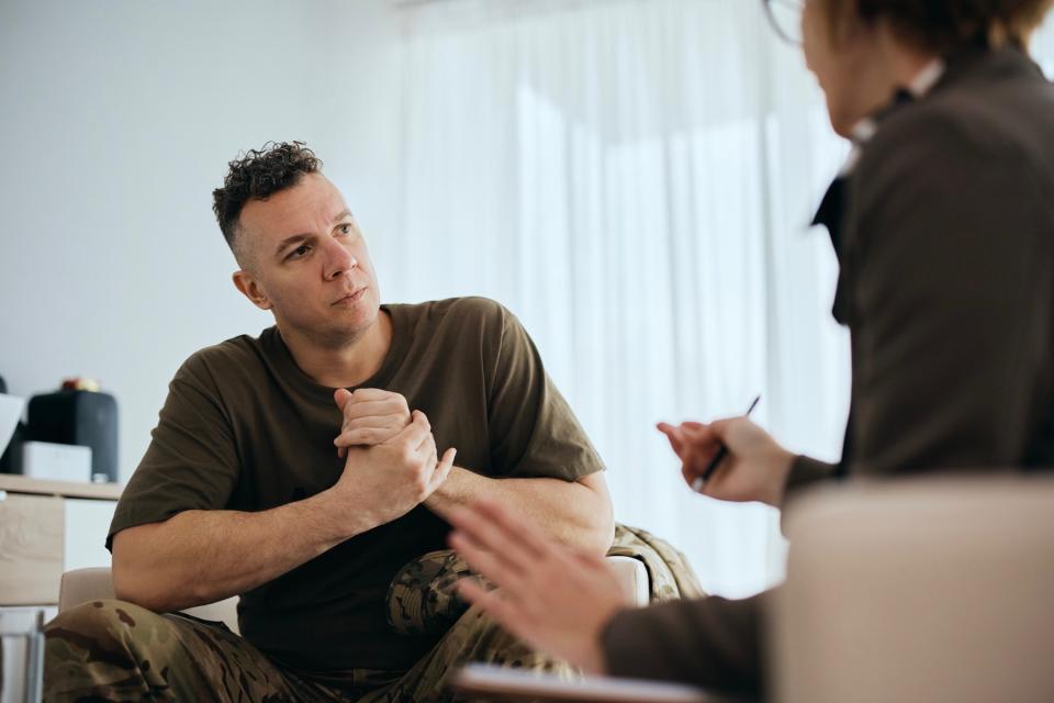 Man meeting with therapist.